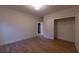 Bright bedroom featuring a hardwood floor and a walk-in closet with white doors at 581 Sherwood Ne Rd, Atlanta, GA 30324
