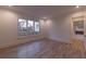 Bedroom features hardwood floors and a large window at 581 Sherwood Ne Rd, Atlanta, GA 30324