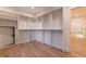 Large walk-in closet with extensive shelving and a door for safe storage at 581 Sherwood Ne Rd, Atlanta, GA 30324