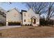 An exterior shot of a modern two-story home with elegant curb appeal at 581 Sherwood Ne Rd, Atlanta, GA 30324