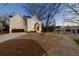 Charming home exterior with clean lines, black trim, and a well-maintained lawn at 581 Sherwood Ne Rd, Atlanta, GA 30324