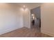 View of a hallway with wood floors and trim with an open doorway at 581 Sherwood Ne Rd, Atlanta, GA 30324