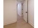 Hallway showing light wood floors and white baseboards at 581 Sherwood Ne Rd, Atlanta, GA 30324