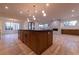 Spacious gourmet kitchen featuring a large center island, modern pendant lights, and open concept design at 581 Sherwood Ne Rd, Atlanta, GA 30324