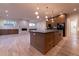 Spacious gourmet kitchen featuring a large center island, modern pendant lights, and open concept design at 581 Sherwood Ne Rd, Atlanta, GA 30324