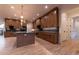 Gourmet kitchen featuring wood cabinets, an island, and stainless steel appliances at 581 Sherwood Ne Rd, Atlanta, GA 30324