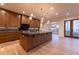 A gourmet kitchen features a large center island, pendant lighting, and custom wood cabinetry at 581 Sherwood Ne Rd, Atlanta, GA 30324