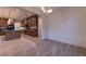 Open floor plan with hardwood floors leading to modern kitchen with stainless steel appliances at 581 Sherwood Ne Rd, Atlanta, GA 30324