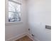 Bright laundry room featuring a window and all necessary hook ups at 581 Sherwood Ne Rd, Atlanta, GA 30324
