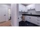White cabinets and black countertops in the laundry room at 581 Sherwood Ne Rd, Atlanta, GA 30324