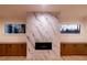 A modern living room features a sleek fireplace, marble surround, and custom built-in cabinetry at 581 Sherwood Ne Rd, Atlanta, GA 30324