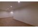Bright living room featuring hardwood floors, recessed lighting, and neutral wall colors at 581 Sherwood Ne Rd, Atlanta, GA 30324