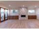Bright living room with hardwood floors, a fireplace with marble surround, and built-in cabinets at 581 Sherwood Ne Rd, Atlanta, GA 30324