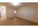 Hardwood floors and neutral paint in a bright living area with open doorway to a bathroom at 581 Sherwood Ne Rd, Atlanta, GA 30324