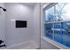 White tiled shower with a window at 581 Sherwood Ne Rd, Atlanta, GA 30324
