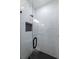 The glass enclosed shower has white tile with a black tiled floor at 581 Sherwood Ne Rd, Atlanta, GA 30324