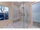 An elegant tiled shower with glass door at 581 Sherwood Ne Rd, Atlanta, GA 30324