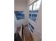 Open staircase with light wood steps, and large windows offering natural light at 581 Sherwood Ne Rd, Atlanta, GA 30324
