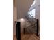 Hardwood staircase featuring black metal railings with wood trim at 581 Sherwood Ne Rd, Atlanta, GA 30324