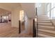 Elegant staircase with wood treads, black iron railings, and open floorplan visible at 581 Sherwood Ne Rd, Atlanta, GA 30324