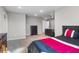 Spacious bedroom features a comfortable bed, soft neutral carpet, and overhead lighting at 202 Via Lucca, Woodstock, GA 30188