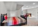 A spacious bedroom features two twin beds, vaulted ceiling, and neutral carpeting at 202 Via Lucca, Woodstock, GA 30188
