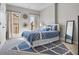 Bright bedroom featuring large windows, neutral walls, and a stylish area rug at 202 Via Lucca, Woodstock, GA 30188