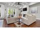 Cozy living room with coffered ceilings, fireplace, hardwood floors, and outdoor access at 202 Via Lucca, Woodstock, GA 30188