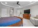 Expansive main bedroom with a large dresser and a view into the luxurious bathroom at 202 Via Lucca, Woodstock, GA 30188