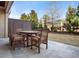 Outdoor patio with stone flooring, surrounded by landscaping and a privacy fence at 202 Via Lucca, Woodstock, GA 30188
