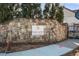 Tuscany Village stone signage sits on a concrete base at 202 Via Lucca, Woodstock, GA 30188