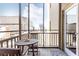 Outdoor balcony featuring a wood table with seating and city views at 300 W Peachtree St # 4A, Atlanta, GA 30308