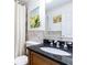 Bathroom features a granite countertop, shower-tub combo, and modern fixtures at 300 W Peachtree St # 4A, Atlanta, GA 30308