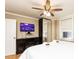 This bedroom features a ceiling fan, TV, and a window with an outside view at 300 W Peachtree St # 4A, Atlanta, GA 30308