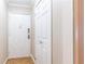 Hallway view with doors and hardwood floors at 300 W Peachtree St # 4A, Atlanta, GA 30308