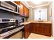 Well-equipped kitchen with stainless appliances, granite counters, and sink at 300 W Peachtree St # 4A, Atlanta, GA 30308