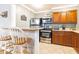Kitchen boasts stainless appliances, granite countertops and wood cabinets at 300 W Peachtree St # 4A, Atlanta, GA 30308