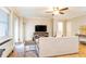 Cozy living room with hardwood floors, ceiling fan, and large windows providing natural light at 300 W Peachtree St # 4A, Atlanta, GA 30308