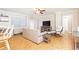 Open living room features hardwood floors and access to the kitchen at 300 W Peachtree St # 4A, Atlanta, GA 30308