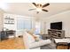 Comfortable living room with ceiling fan and sliding door to balcony at 300 W Peachtree St # 4A, Atlanta, GA 30308
