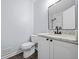 Updated bathroom showcasing a marble vanity top, a modern faucet, and a sleek toilet at 463 Flint Trl, Jonesboro, GA 30236