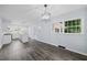 Open dining area and a stylish light fixture with a view of the updated kitchen at 463 Flint Trl, Jonesboro, GA 30236
