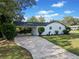 Exterior side view with a covered parking area and well-maintained landscaping at 463 Flint Trl, Jonesboro, GA 30236