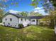 Charming home with lush landscaping, mature trees, and a well-manicured lawn at 463 Flint Trl, Jonesboro, GA 30236