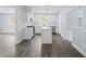 Open-concept kitchen features modern appliances, a center island, and hardwood floors at 463 Flint Trl, Jonesboro, GA 30236