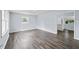 Spacious living room filled with natural light and modern hardwood flooring at 463 Flint Trl, Jonesboro, GA 30236