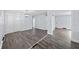 This living room boasts stylish light fixtures and sleek wood flooring for a modern touch at 463 Flint Trl, Jonesboro, GA 30236