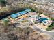 Aerial view of neighborhood amenities including tennis courts, playground and pool at 6615 Grove Meadows Ln, Cumming, GA 30028