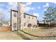 Spacious backyard featuring a patio, garden, and well-maintained lawn at 6615 Grove Meadows Ln, Cumming, GA 30028