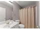 Bathroom with toilet, shower, and vanity at 6615 Grove Meadows Ln, Cumming, GA 30028